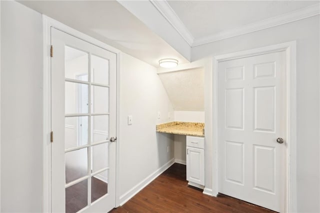 bathroom with crown molding, baseboards, and wood finished floors