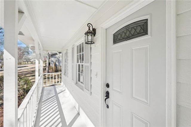 property entrance with covered porch