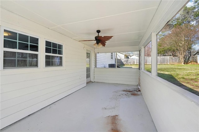 view of patio / terrace featuring central AC, fence, and a ceiling fan