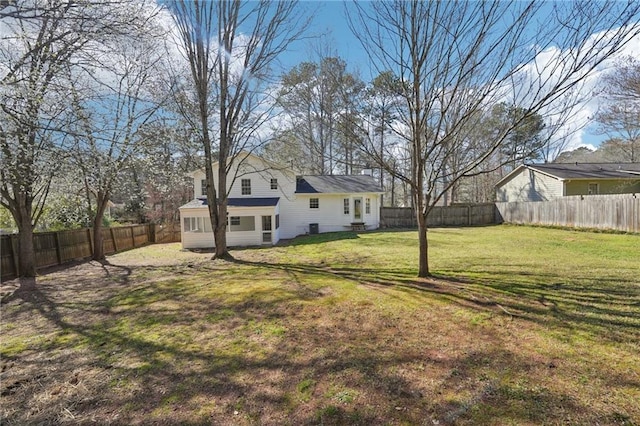 view of yard with a fenced backyard