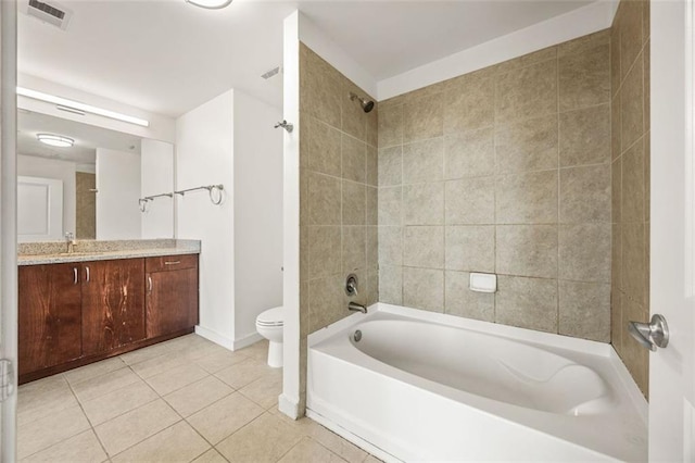 bathroom featuring tile patterned flooring, toilet, shower / tub combination, vanity, and baseboards