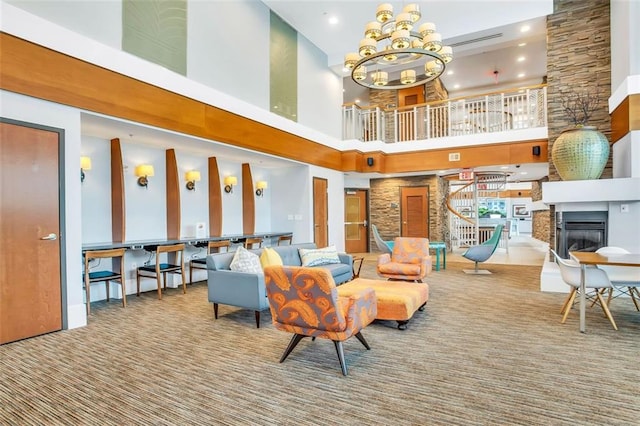 building lobby with a high ceiling, stairway, and recessed lighting