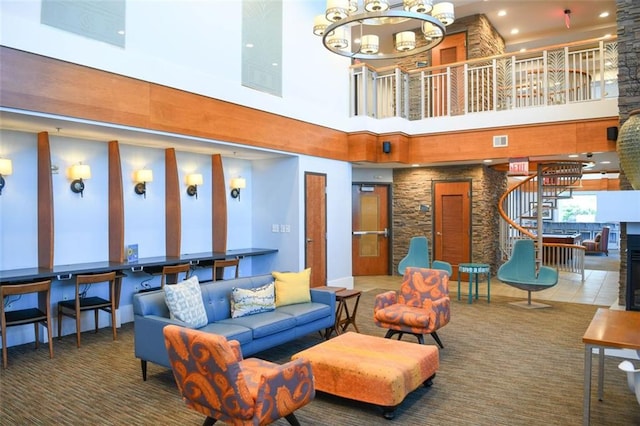 lobby featuring a high ceiling, stairs, and recessed lighting