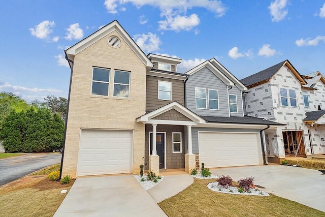view of front of home with a garage and driveway