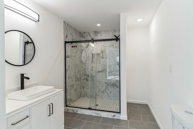 full bathroom featuring vanity, toilet, recessed lighting, tile patterned floors, and a marble finish shower