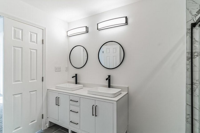 bathroom featuring double vanity and a sink