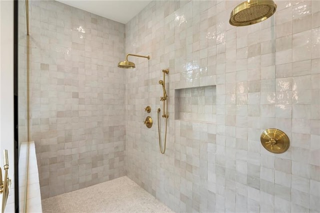 bathroom with tiled shower