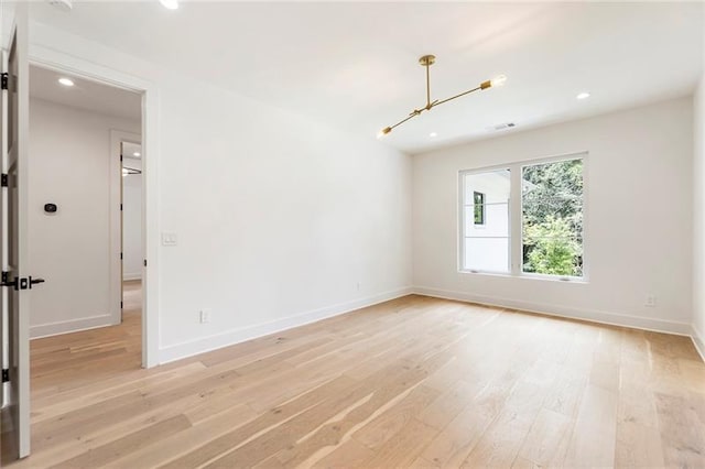 unfurnished room featuring light hardwood / wood-style flooring