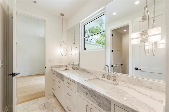 bathroom with vanity and wood-type flooring