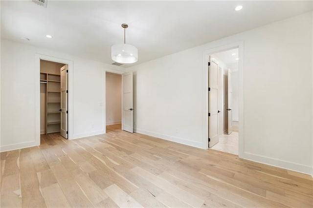 unfurnished room with light hardwood / wood-style floors