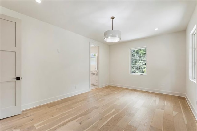 unfurnished room featuring light wood-type flooring