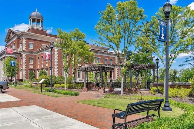 view of property's community featuring a pergola