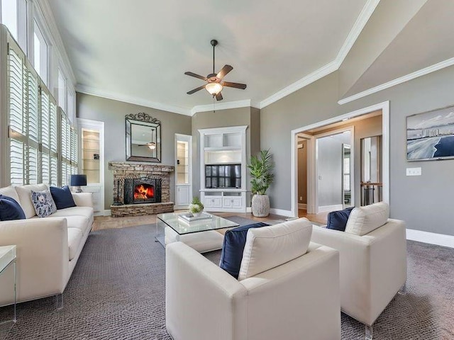 535 Crested Hawk Rdg, Canton, GA 30114 - living area with crown molding, plenty of natural light, a stone fireplace, and ceiling fan