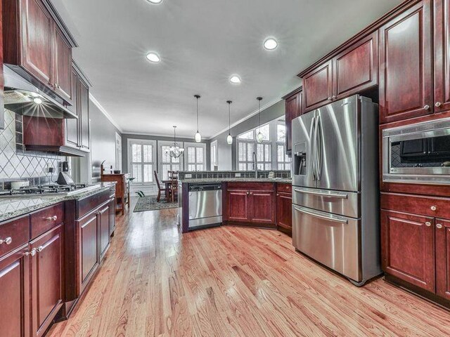 535 Crested Hawk Rdg, Canton, GA 30114 - kitchen featuring recessed lighting, a notable chandelier, appliances with stainless steel finishes, and ornamental molding