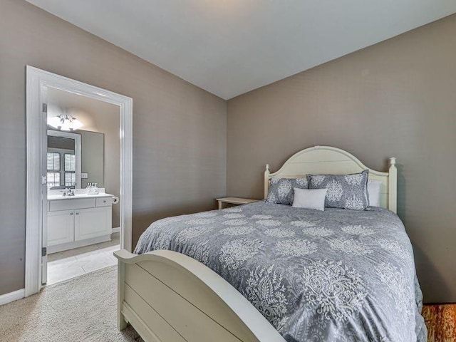 535 Crested Hawk Rdg, Canton, GA 30114 - bedroom with connected bathroom, light carpet, and baseboards