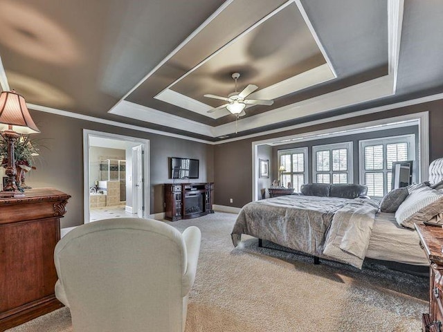 535 Crested Hawk Rdg, Canton, GA 30114 - carpeted bedroom featuring a tray ceiling, crown molding, baseboards, ceiling fan, and ensuite bathroom