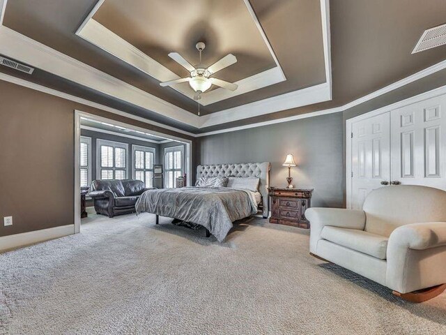 535 Crested Hawk Rdg, Canton, GA 30114 - bedroom with a tray ceiling, carpet floors, visible vents, and crown molding