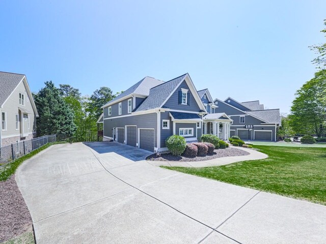535 Crested Hawk Rdg, Canton, GA 30114 - view of front of property with concrete driveway, an attached garage, fence, and a front lawn