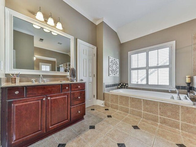 535 Crested Hawk Rdg, Canton, GA 30114 - bathroom featuring vaulted ceiling, crown molding, a bath, vanity, and tile patterned flooring