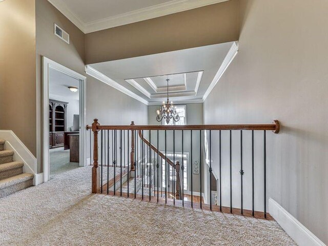 535 Crested Hawk Rdg, Canton, GA 30114 - hall featuring ornamental molding, a notable chandelier, carpet flooring, and visible vents
