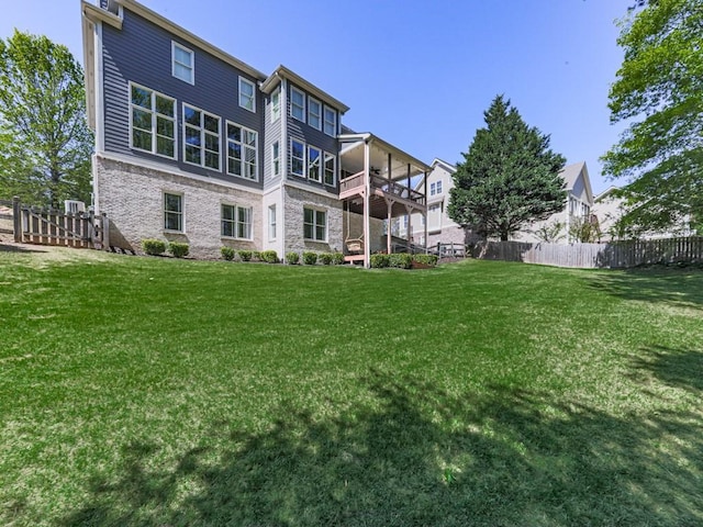 535 Crested Hawk Rdg, Canton, GA 30114 - rear view of house featuring a lawn and fence