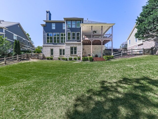 535 Crested Hawk Rdg, Canton, GA 30114 - back of property featuring a chimney, stone siding, a fenced backyard, a yard, and ceiling fan