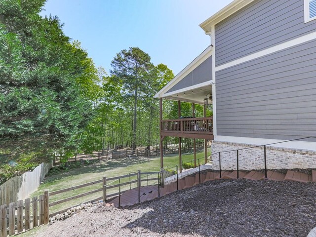 535 Crested Hawk Rdg, Canton, GA 30114 - view of yard with a wooden deck, fence, and ceiling fan