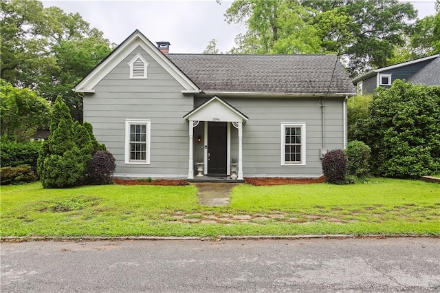 1096 Tilden St NW, Atlanta, GA 30318 - view of front of property with a front yard, a chimney, and a shingled roof