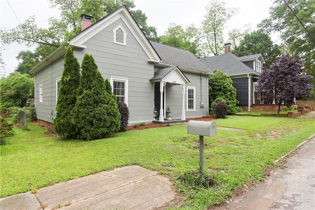 1096 Tilden St NW, Atlanta, GA 30318 - view of front of home featuring a chimney and a front lawn