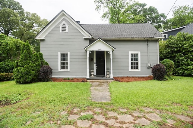1096 Tilden St NW, Atlanta, GA 30318 - view of front facade featuring a front yard and roof with shingles