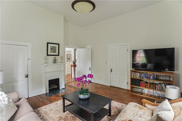 1096 Tilden St NW, Atlanta, GA 30318 - living area featuring wood finished floors, a fireplace, and a high ceiling