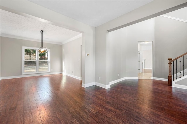 interior space with dark hardwood / wood-style flooring and ornamental molding