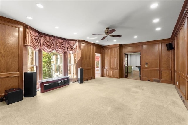 interior space with recessed lighting, light carpet, a decorative wall, visible vents, and ornamental molding