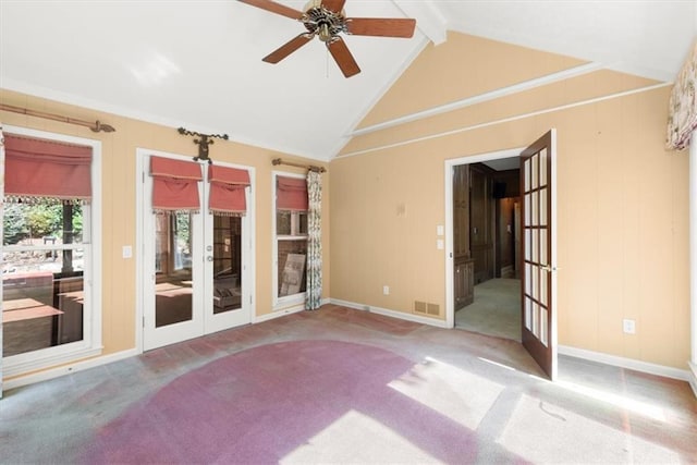 carpeted empty room featuring baseboards, visible vents, a ceiling fan, lofted ceiling with beams, and french doors