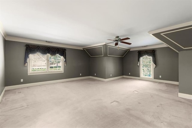 bonus room with light carpet, ceiling fan, baseboards, and vaulted ceiling