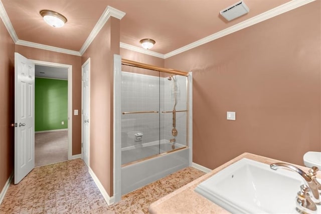 bathroom featuring baseboards, a sink, enclosed tub / shower combo, and crown molding