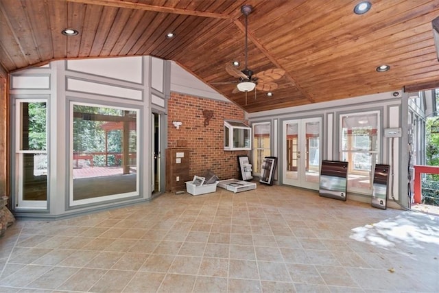 interior space with a healthy amount of sunlight, wooden ceiling, and vaulted ceiling