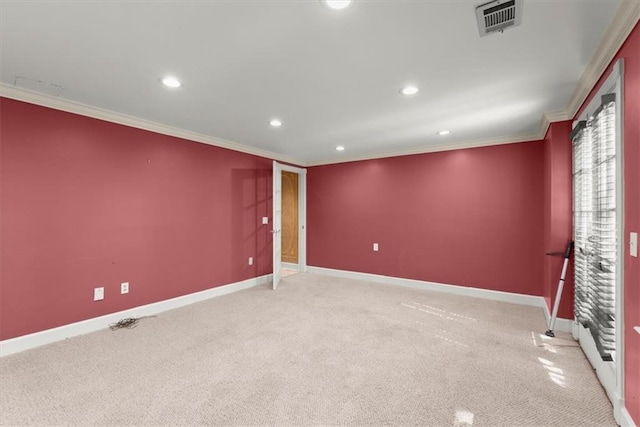 carpeted spare room featuring visible vents, ornamental molding, baseboards, and recessed lighting