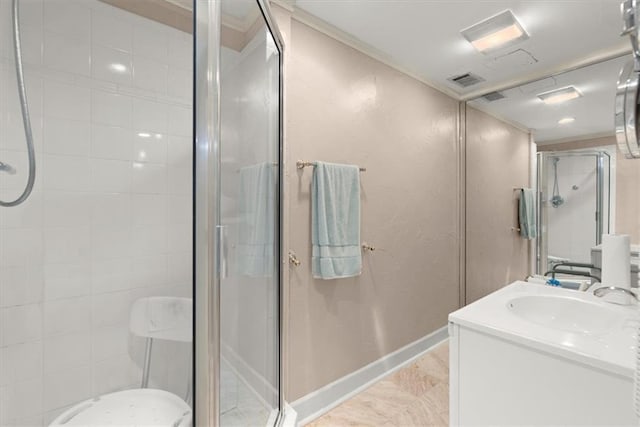 bathroom with visible vents, baseboards, ornamental molding, vanity, and a shower stall