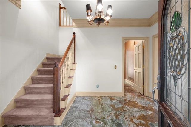 entrance foyer with baseboards, crown molding, stairway, and a notable chandelier