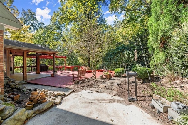 view of patio with a wooden deck