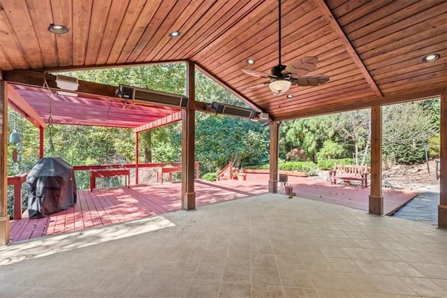 view of patio with a ceiling fan, grilling area, and a wooden deck