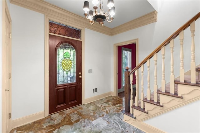 entrance foyer with visible vents, baseboards, ornamental molding, an inviting chandelier, and stairs