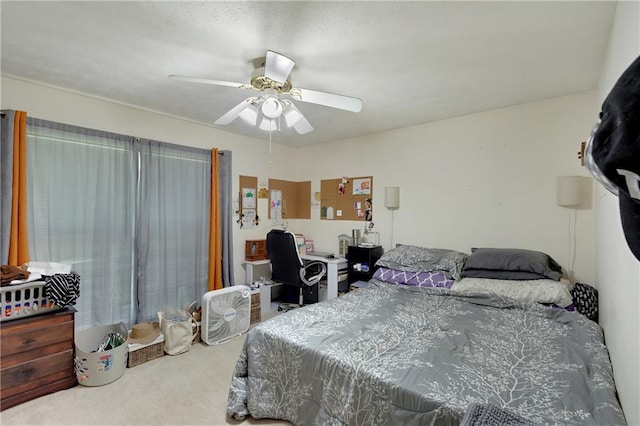 bedroom featuring ceiling fan and carpet flooring