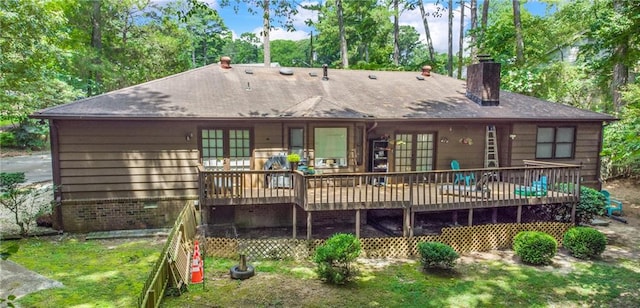 rear view of property with french doors and a deck