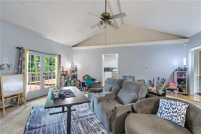 living room with ceiling fan, high vaulted ceiling, french doors, and light colored carpet