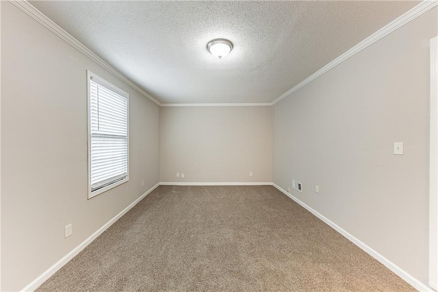 empty room featuring visible vents, ornamental molding, a textured ceiling, carpet, and baseboards