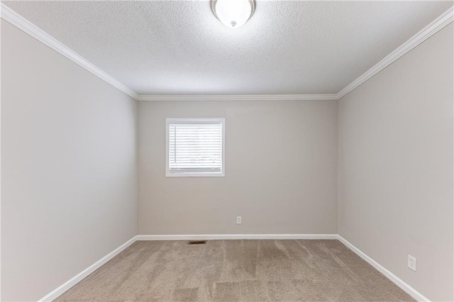 spare room featuring visible vents, a textured ceiling, baseboards, and carpet floors