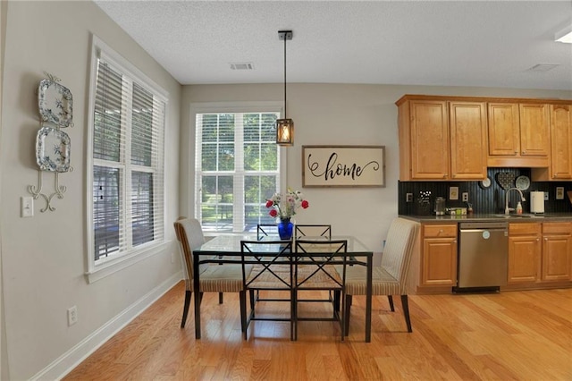 125 Rabbits Run, Fayetteville, GA 30215 - dining room featuring light wood-type flooring, baseboards, and a textured ceiling
