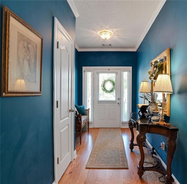 125 Rabbits Run, Fayetteville, GA 30215 - foyer entrance featuring a textured ceiling, wood finished floors, and crown molding